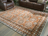 A2Z Furniture - Ashley Furniture - Qaabiz Rug - 5' x 7' Area Rug / Sienna/Ivory/Black - R407522