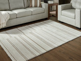 A2Z Furniture - Ashley Furniture - Gadence Rug - 5' x 7' Area Rug / Ivory/Tan - R407642