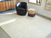 A2Z Furniture - Ashley Furniture - Wolbert Rug - 5' x 7' Area Rug / Tan/Ivory - R407662