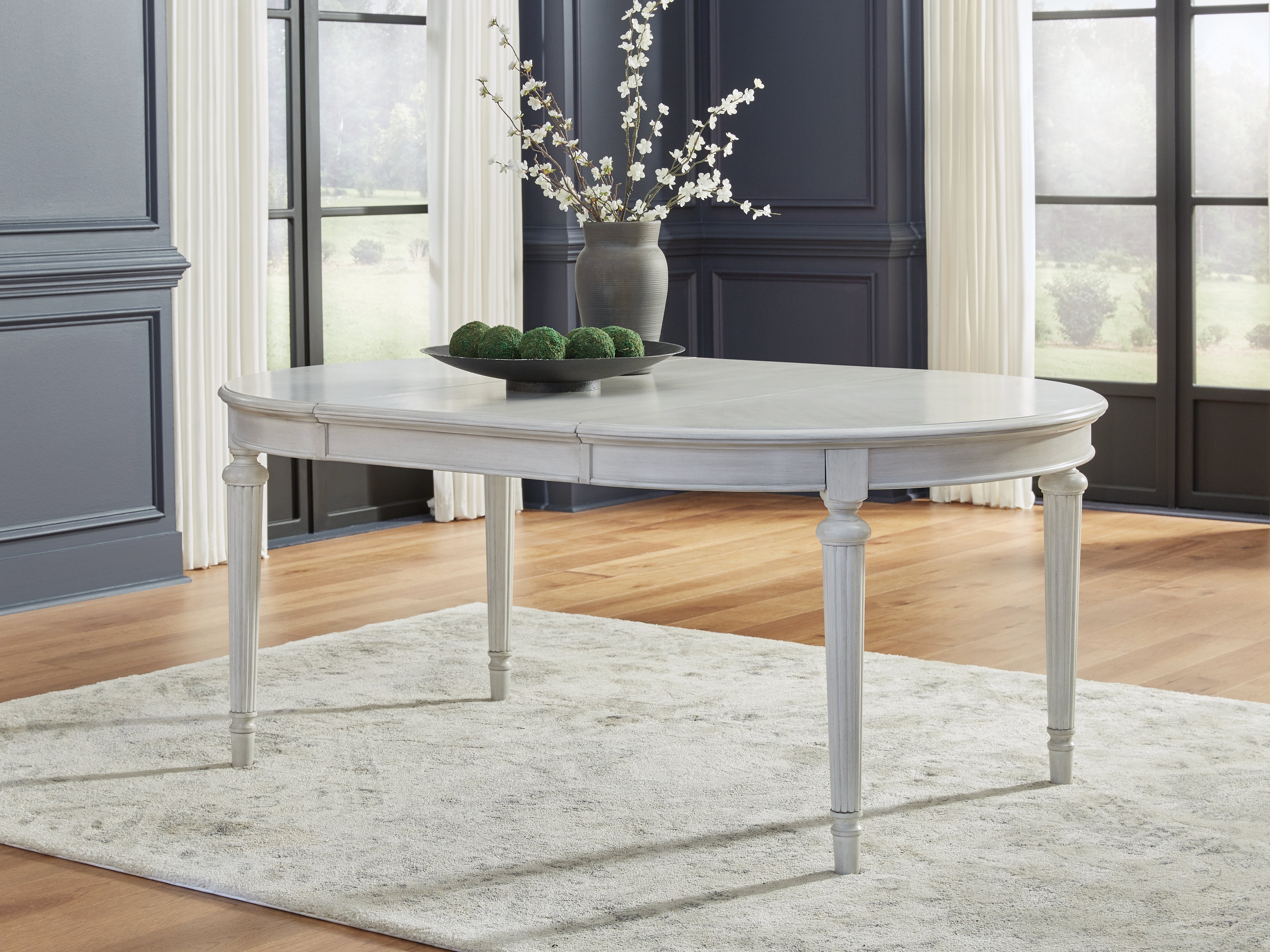 A2Z Furniture - Ashley Furniture - Montelaine Dining Room - Oval Dining Room EXT Table / Antique White - D795-35
