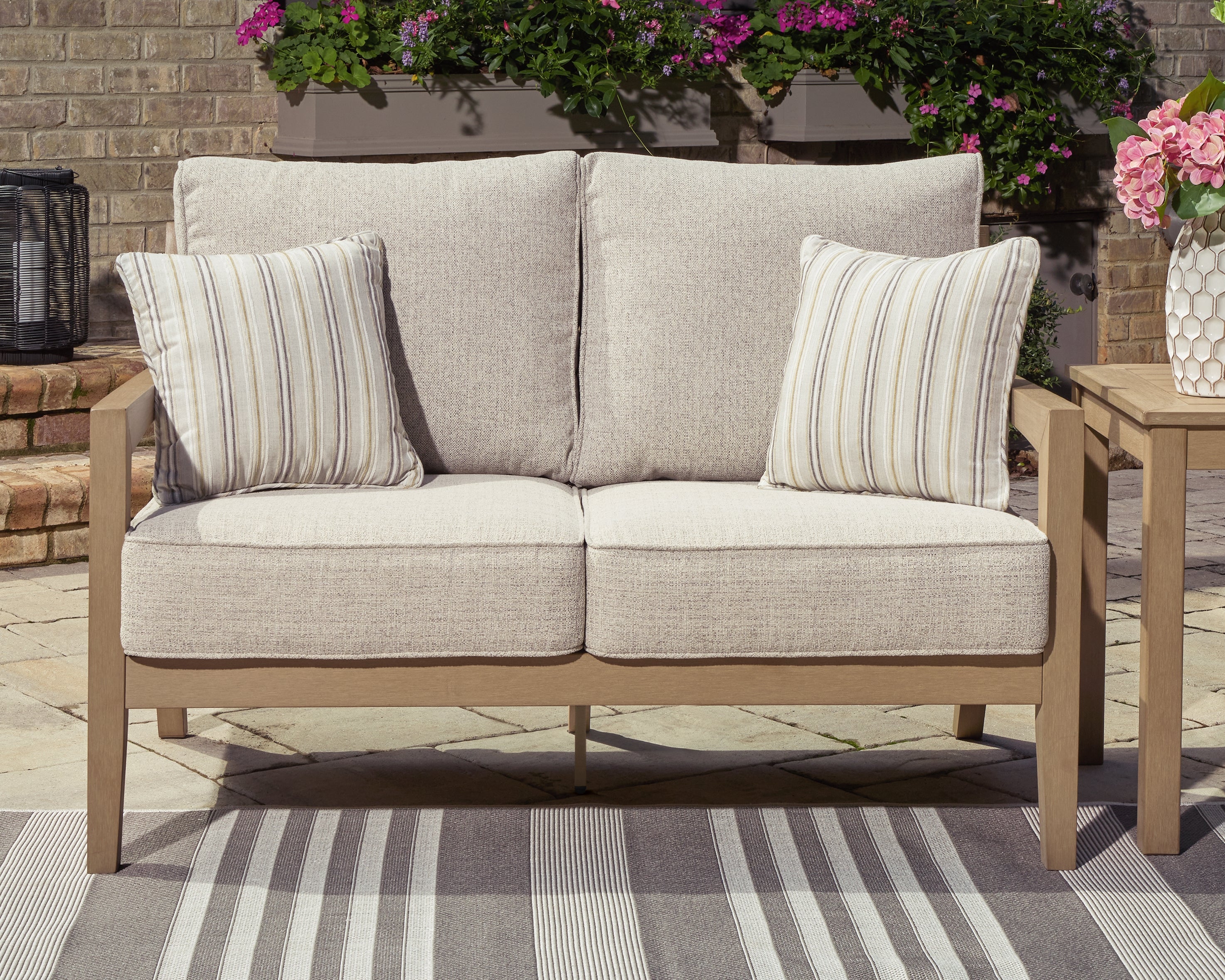 A2Z Furniture - Ashley Furniture - Hallow Creek Outdoor - Loveseat w/Cushion / Driftwood - P560-835