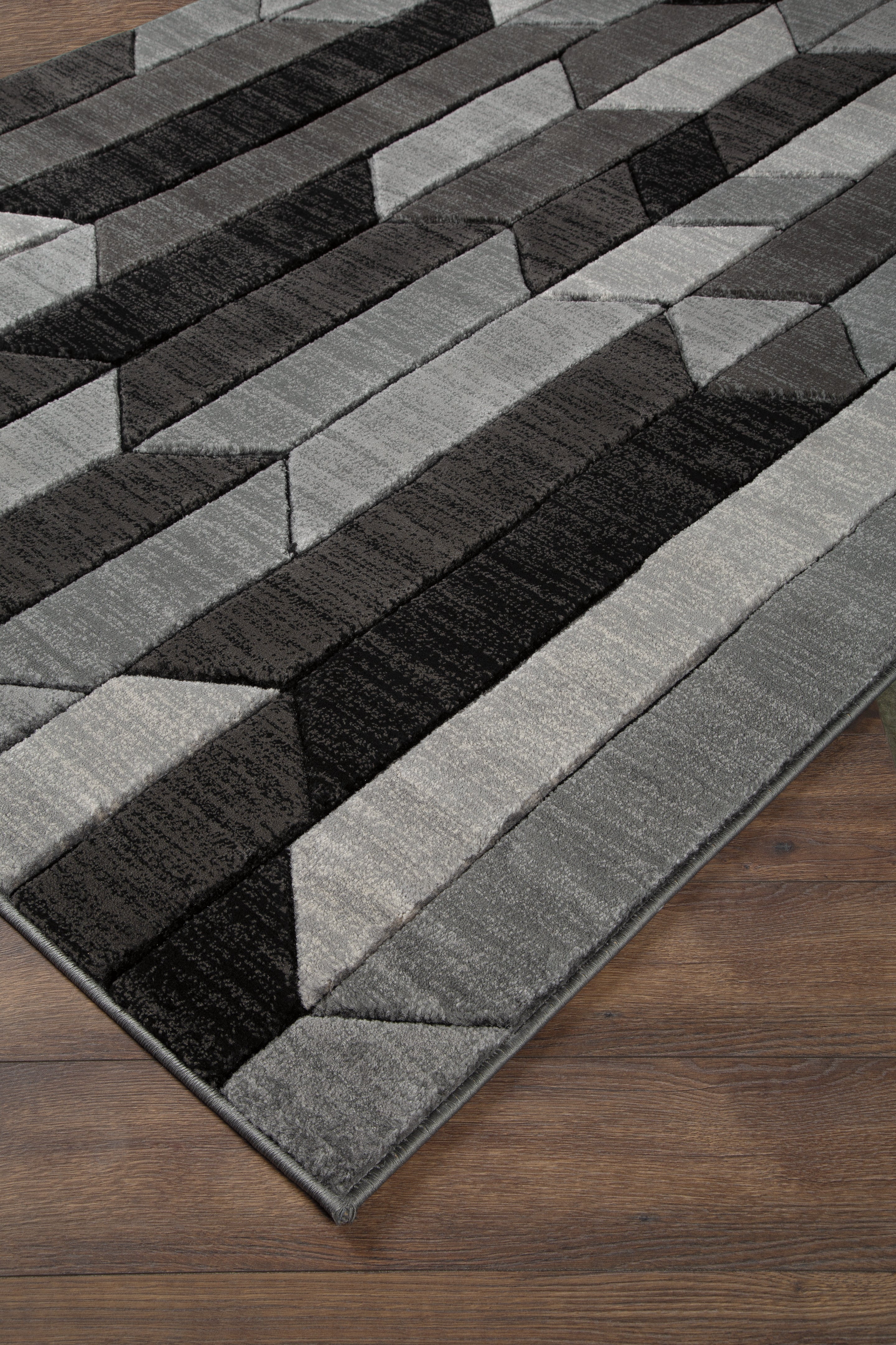 A2Z Furniture - Ashley Furniture - Chayse Rug - 6'6" x 9'6" Rug / Black/Gray - R403461