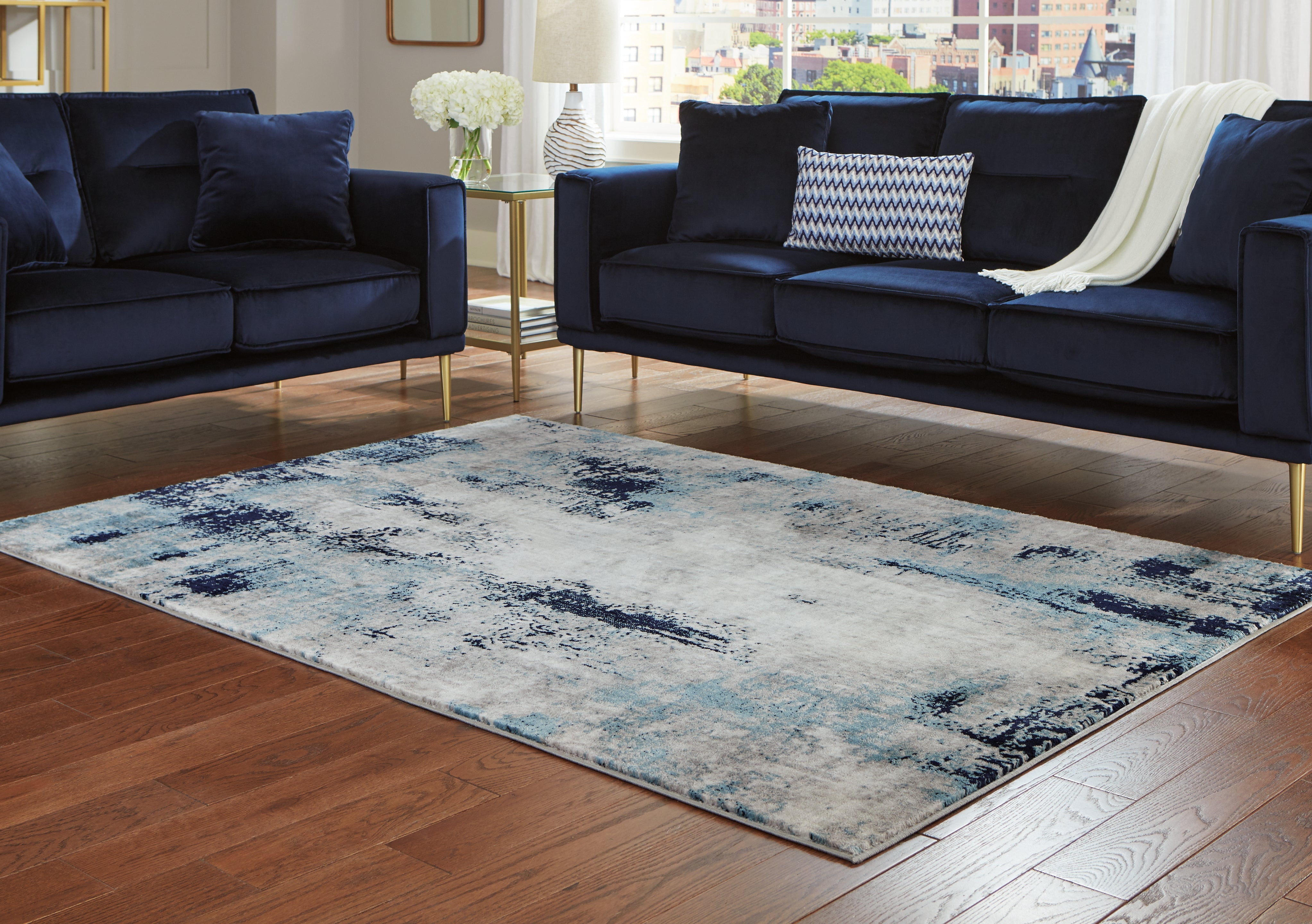 A2Z Furniture - Ashley Furniture - Leonelle Rug - 7'10" x 10' Rug / White/Blue/Gray - R404871