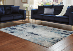 A2Z Furniture - Ashley Furniture - Leonelle Rug - 7'10" x 10' Rug / White/Blue/Gray - R404871