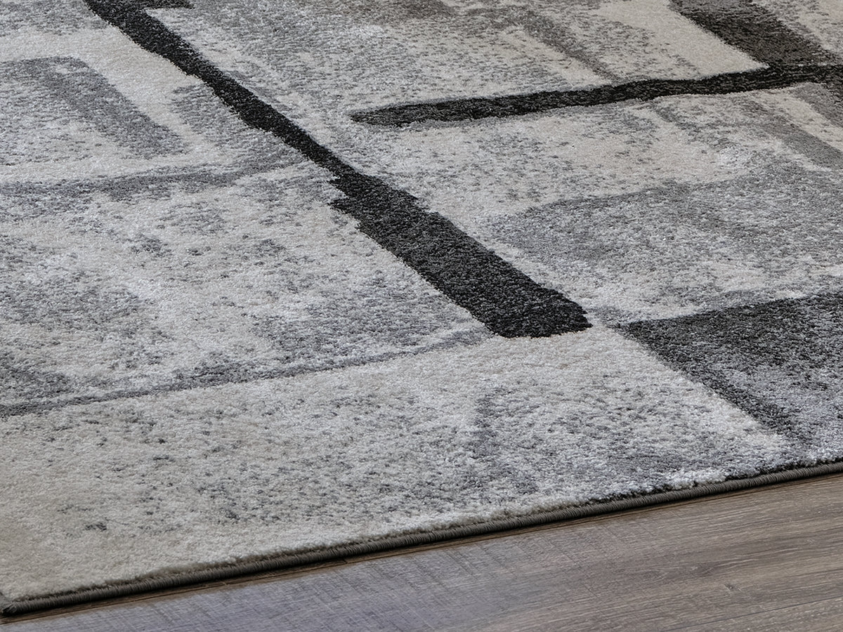 A2Z Furniture - Ashley Furniture - Brycebourne Rug - 5'3" x 7'7" Rug / Black/Cream/Gray - R404982
