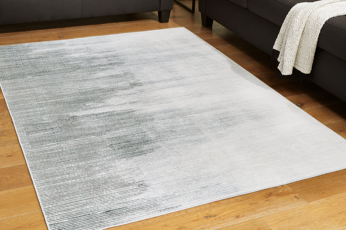 A2Z Furniture - Ashley Furniture - Milset Rug - 5'1" x 6'10" Washable Rug / Black/White/Gray - R406252