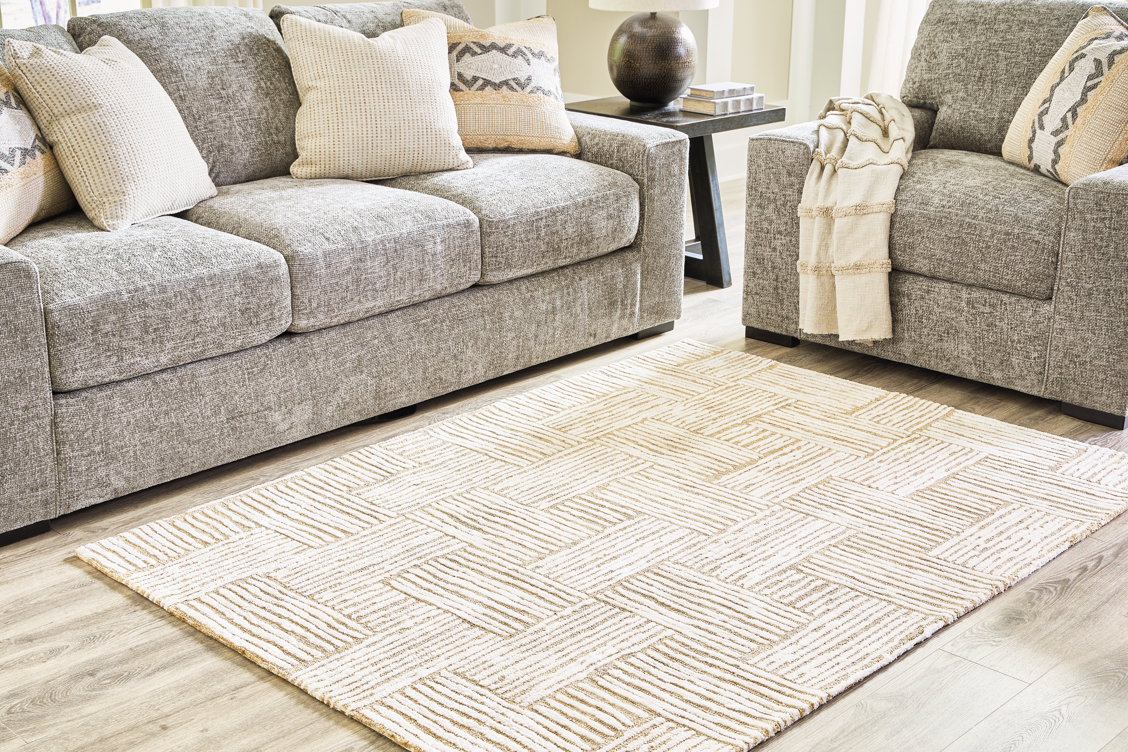 A2Z Furniture - Ashley Furniture - Adanmund Rug - 5' x 7' Rug / Beige/Caramel - R406412