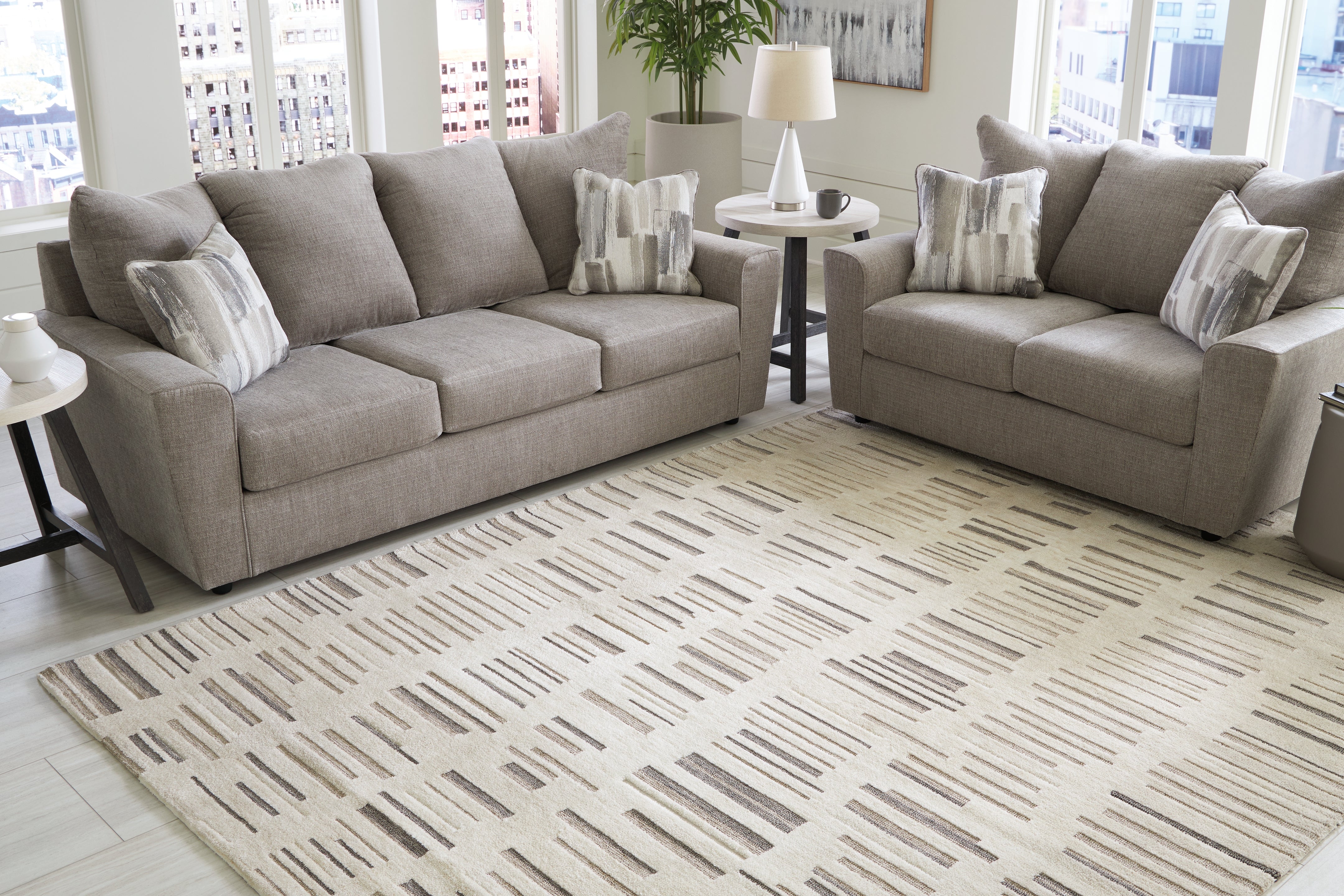 A2Z Furniture - Ashley Furniture - Leesdale Rug - 8' x 10' Rug / Ivory/Brown/Black - R406421