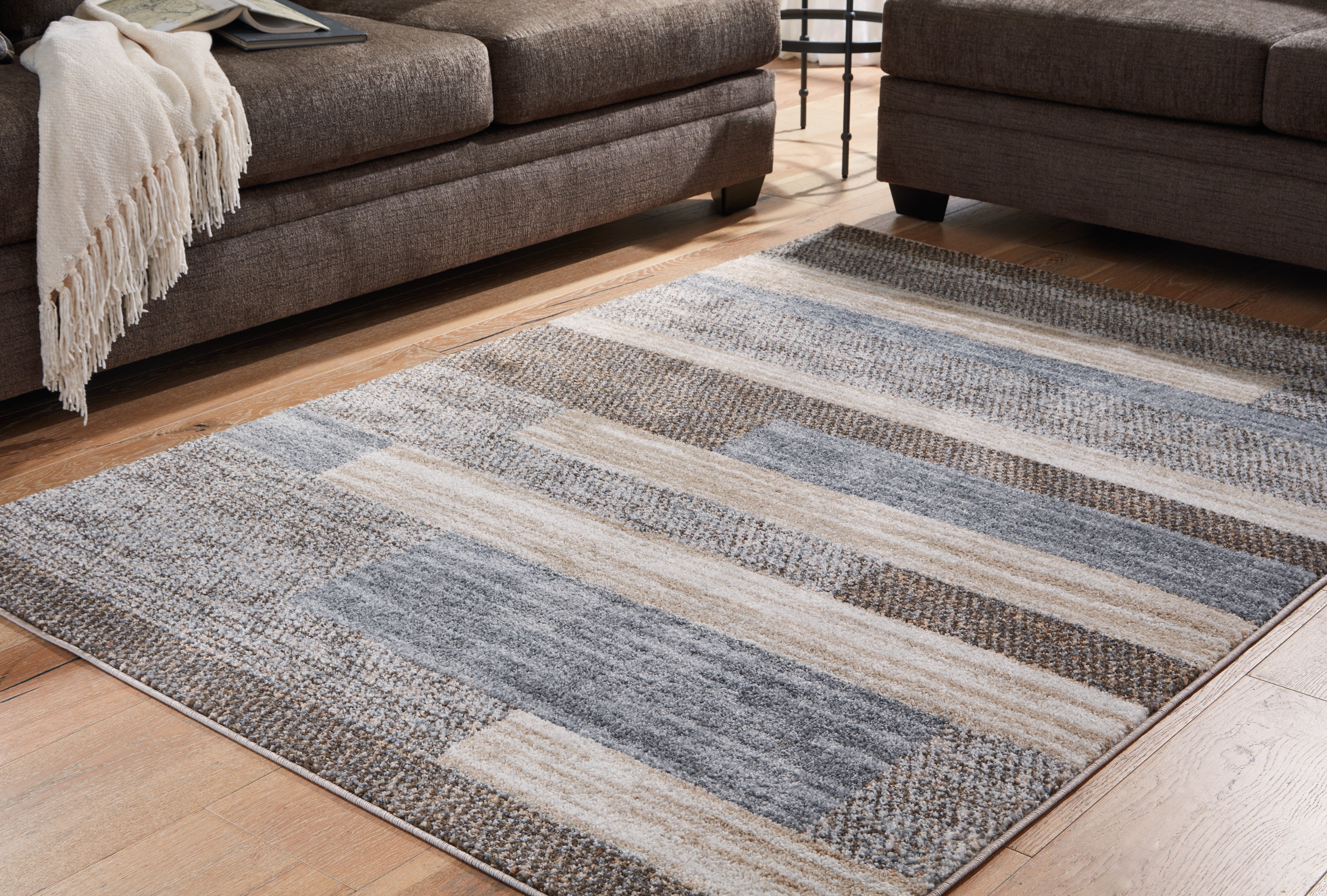 A2Z Furniture - Ashley Furniture - Sethburn Rug - 8' x 10' Rug / Cream/Brown/Gray - R406591