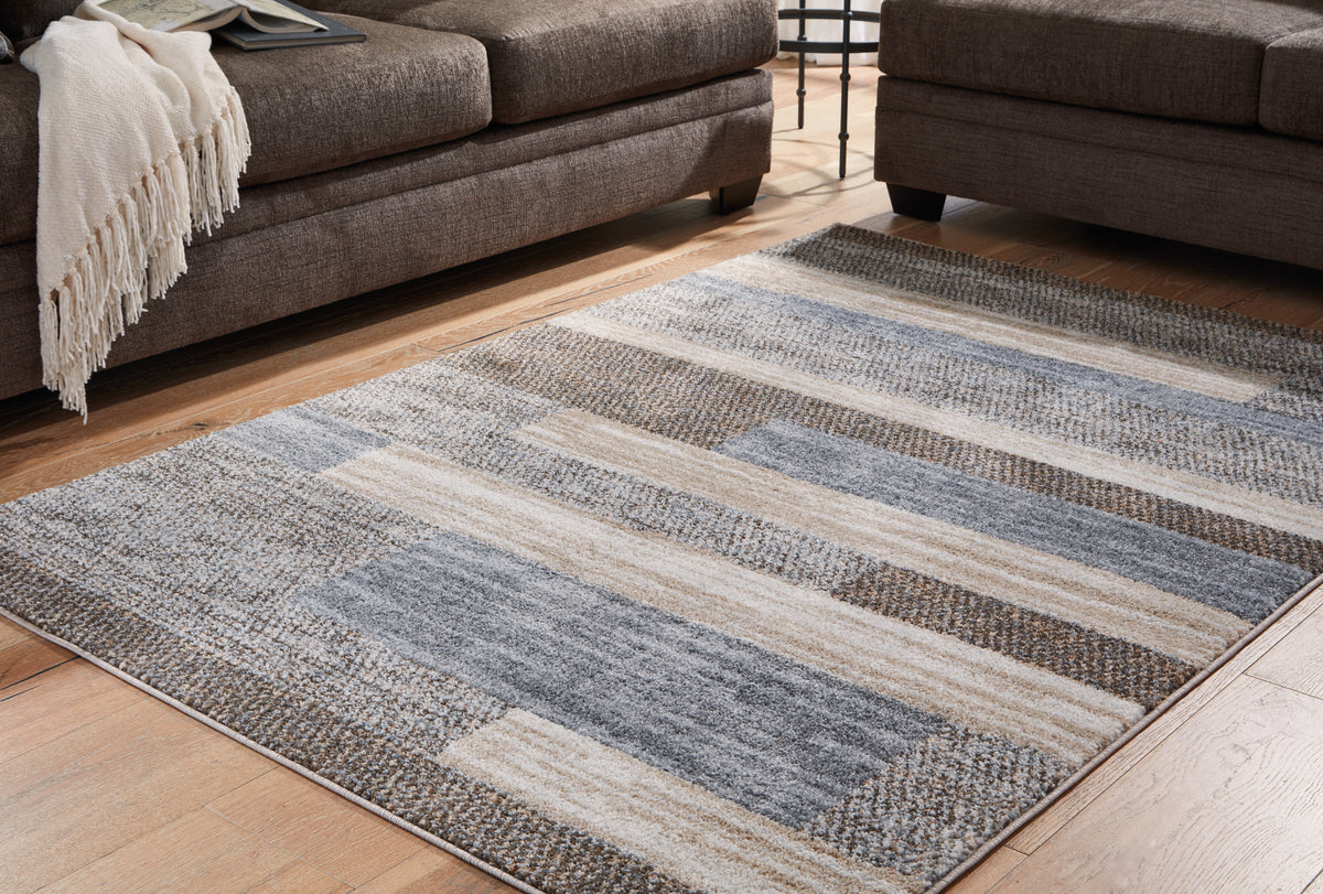 A2Z Furniture - Ashley Furniture - Sethburn Rug - 8' x 10' Rug / Cream/Brown/Gray - R406591