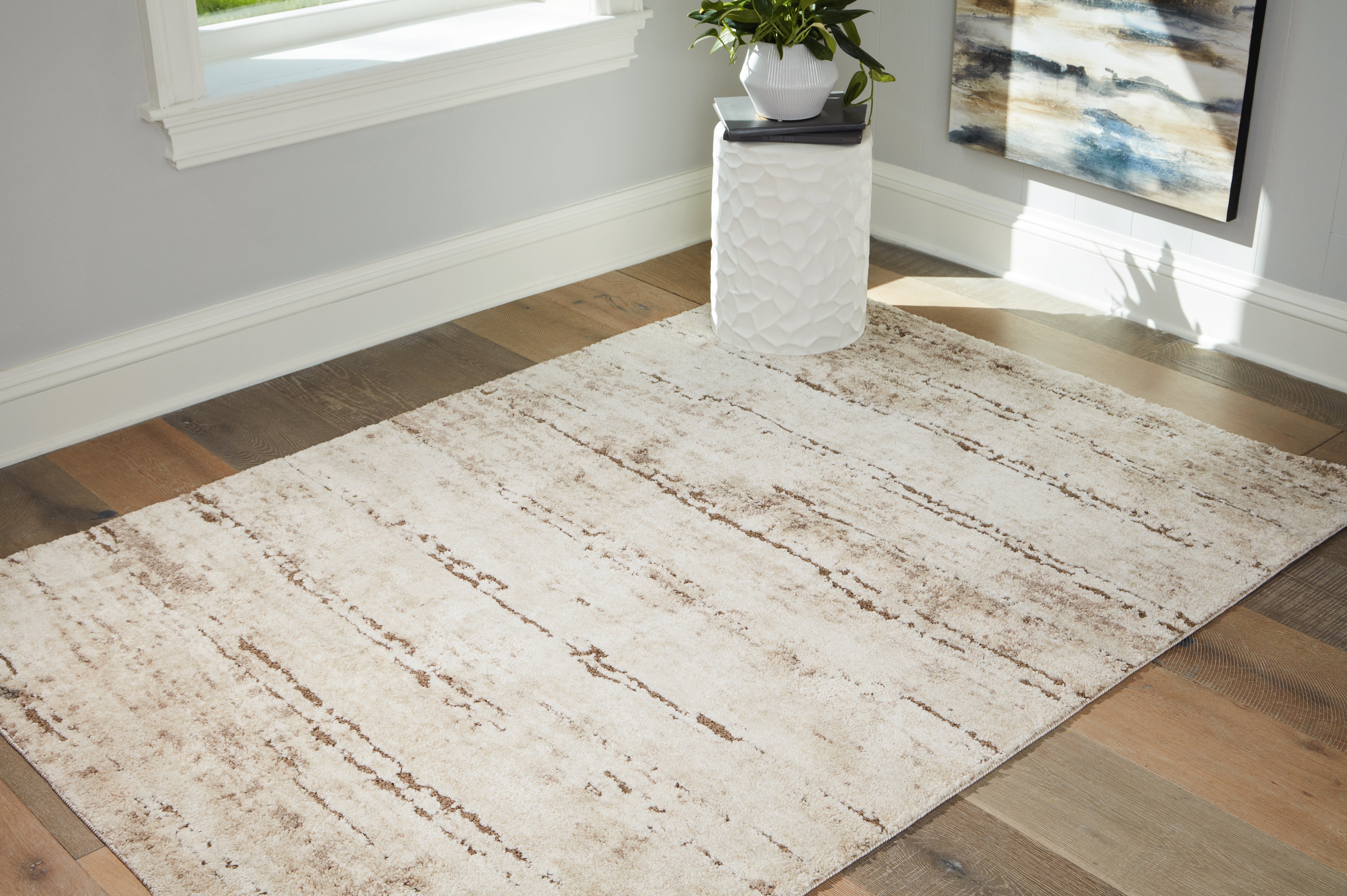 A2Z Furniture - Ashley Furniture - Kasney Rug - 5' x 7' Rug / Cream/Brown - R406852