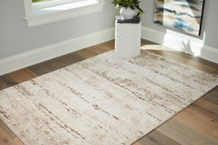 A2Z Furniture - Ashley Furniture - Kasney Rug - 5' x 7' Rug / Cream/Brown - R406852