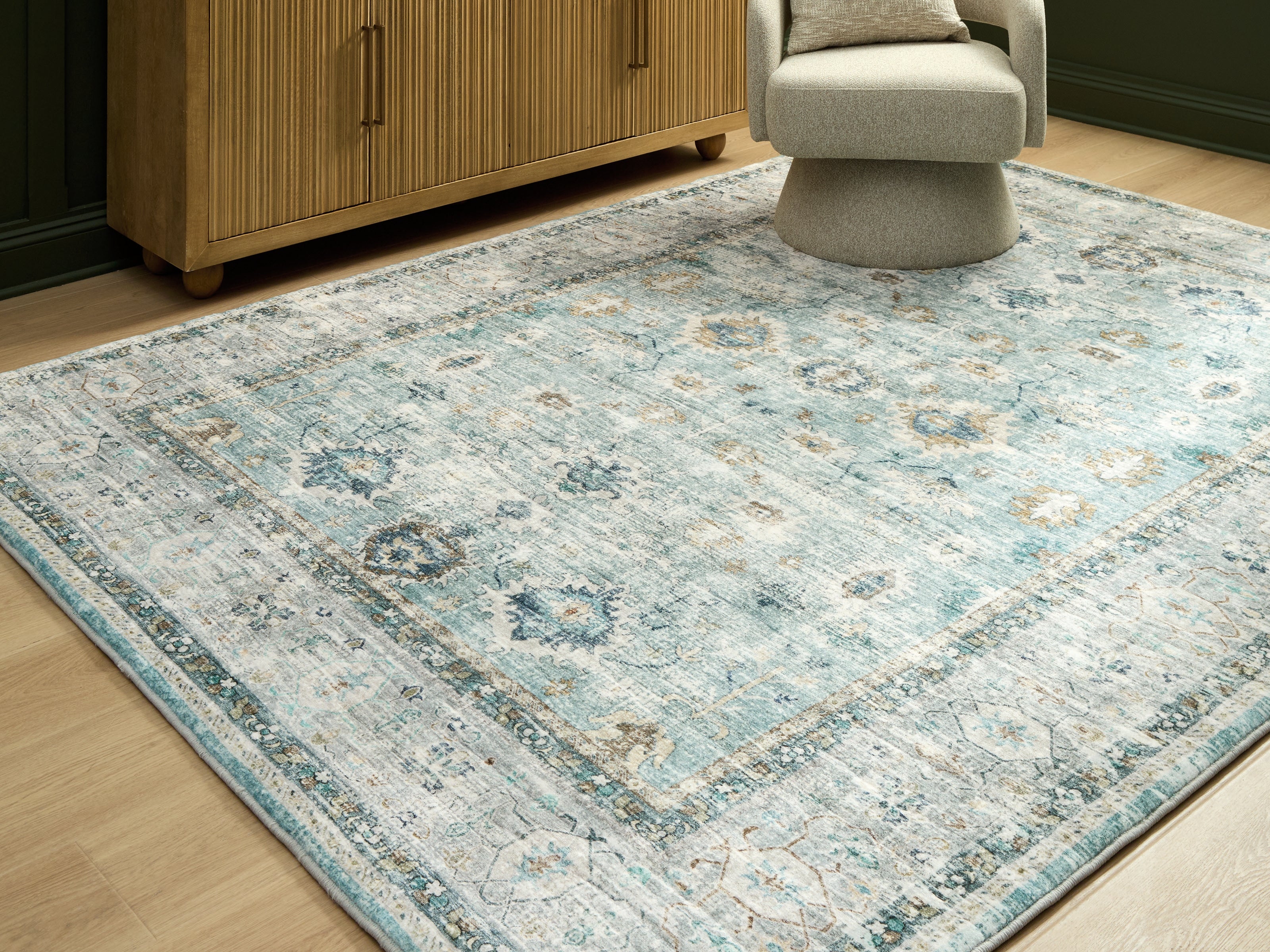 A2Z Furniture - Ashley Furniture - Ladstoney Rug - 7'6" x 9'6" Area Rug / Teal/Beige/Ochre - R407501