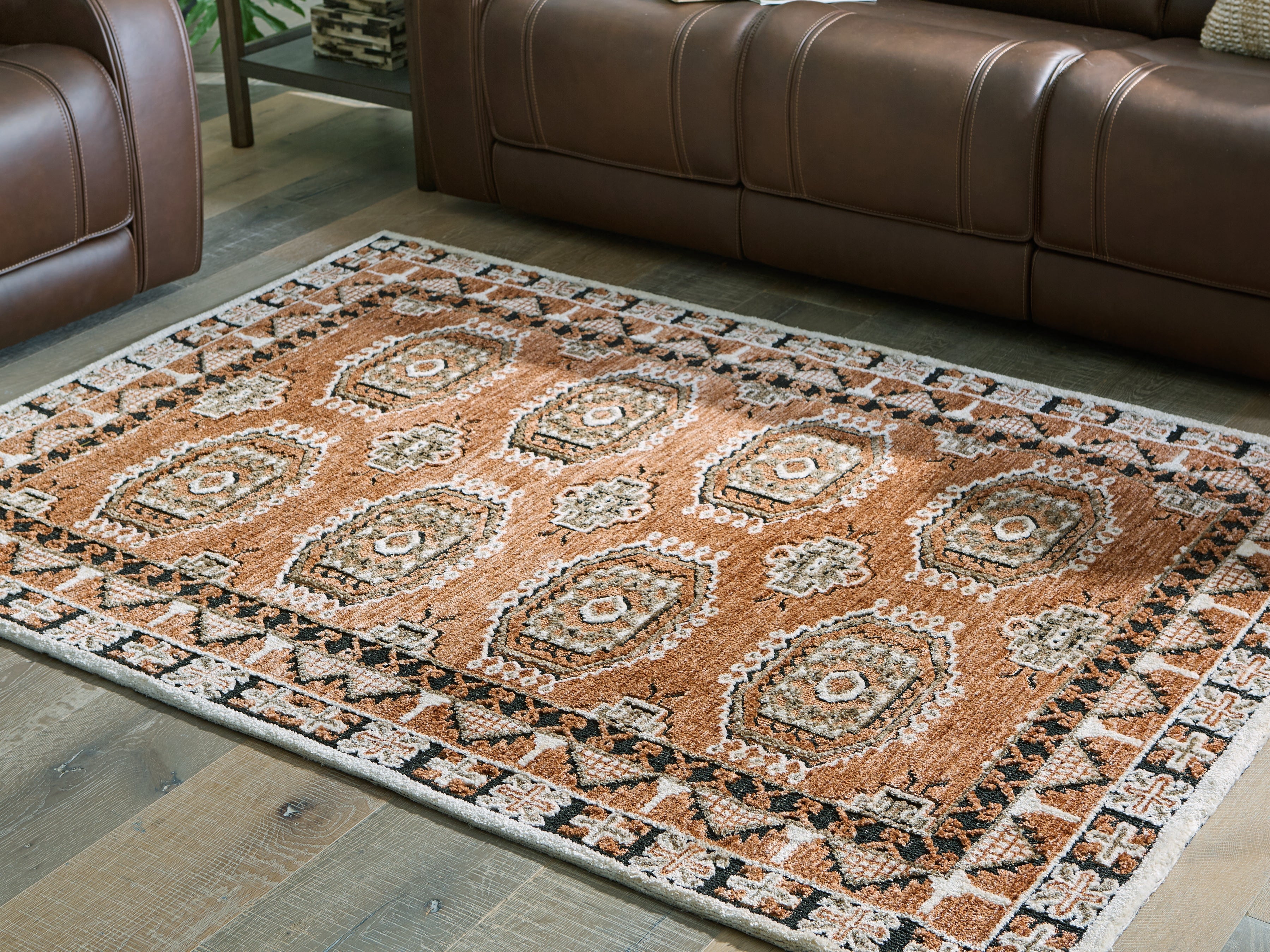 A2Z Furniture - Ashley Furniture - Qaabiz Rug - 5' x 7' Area Rug / Sienna/Ivory/Black - R407522