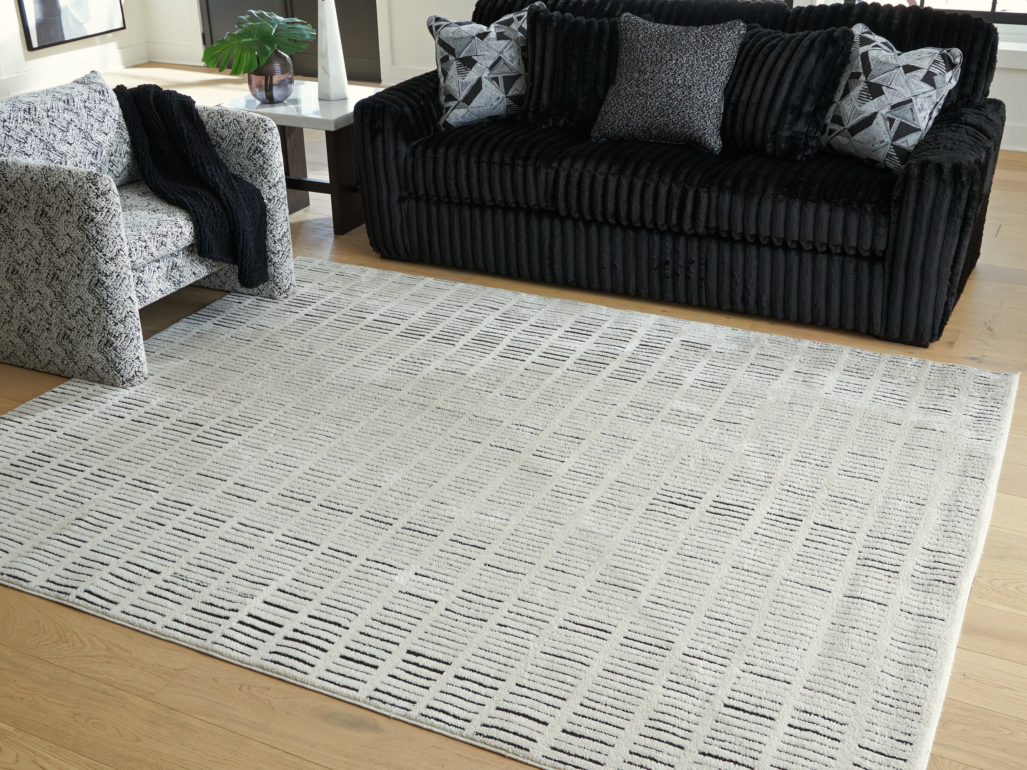 A2Z Furniture - Ashley Furniture - Turinwith Rug - 7'10" x 9'10" Area Rug / Ivory/Black - R407551