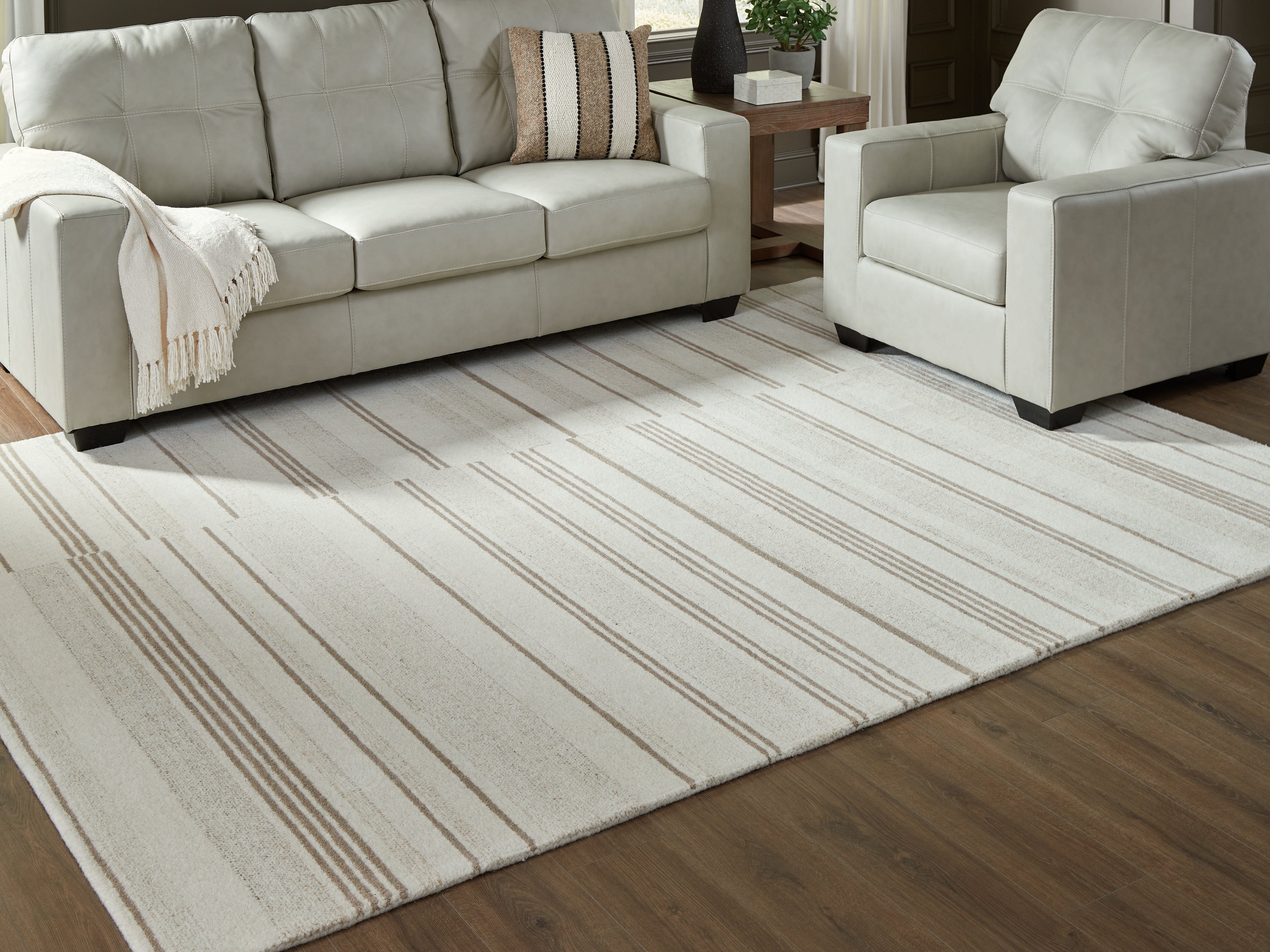 A2Z Furniture - Ashley Furniture - Gadence Rug - 7'8" x 10' Area Rug / Ivory/Tan - R407641
