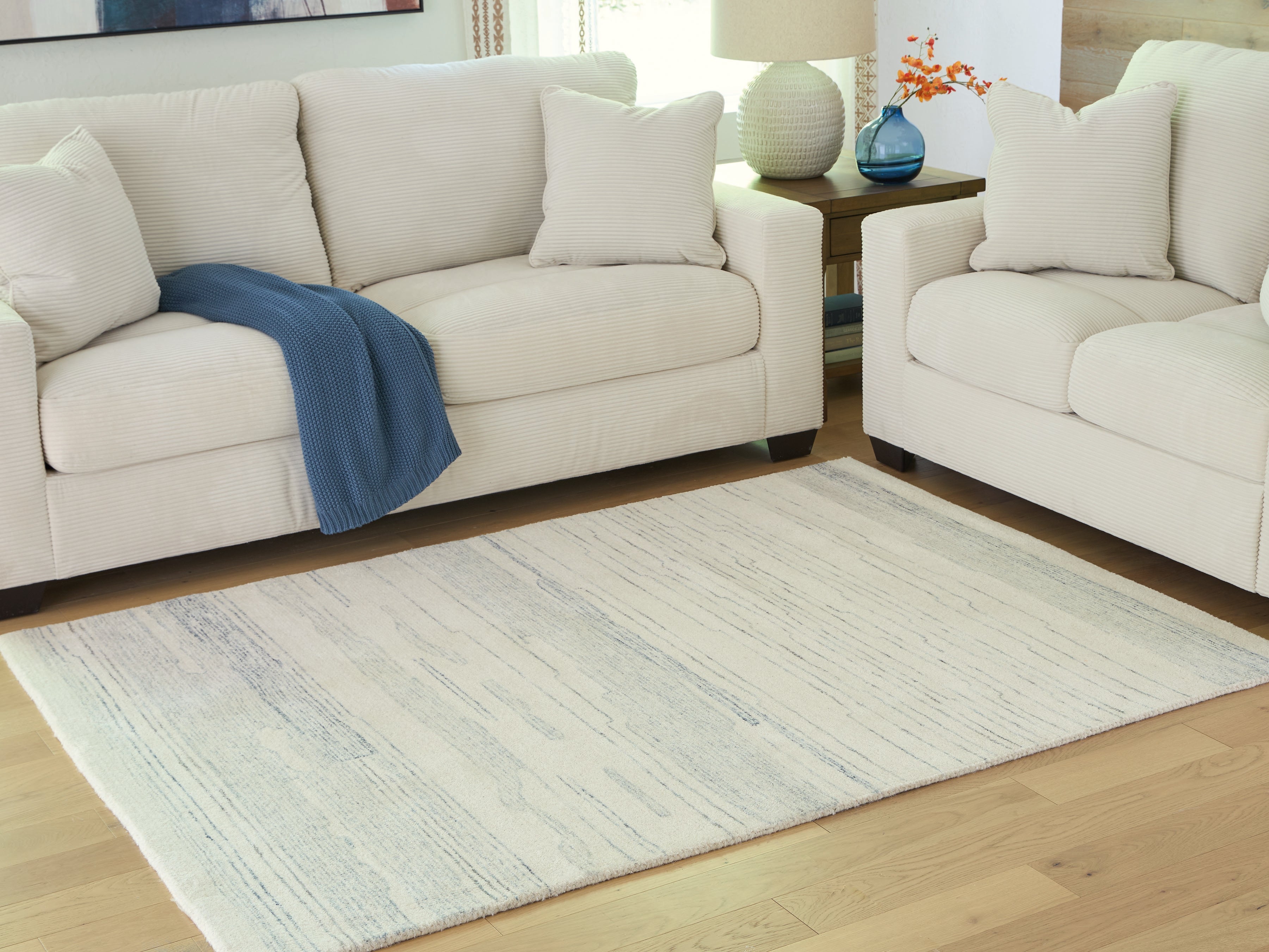 A2Z Furniture - Ashley Furniture - Genemost Rug - 5' x 7' Area Rug / Ivory/Blue - R407842