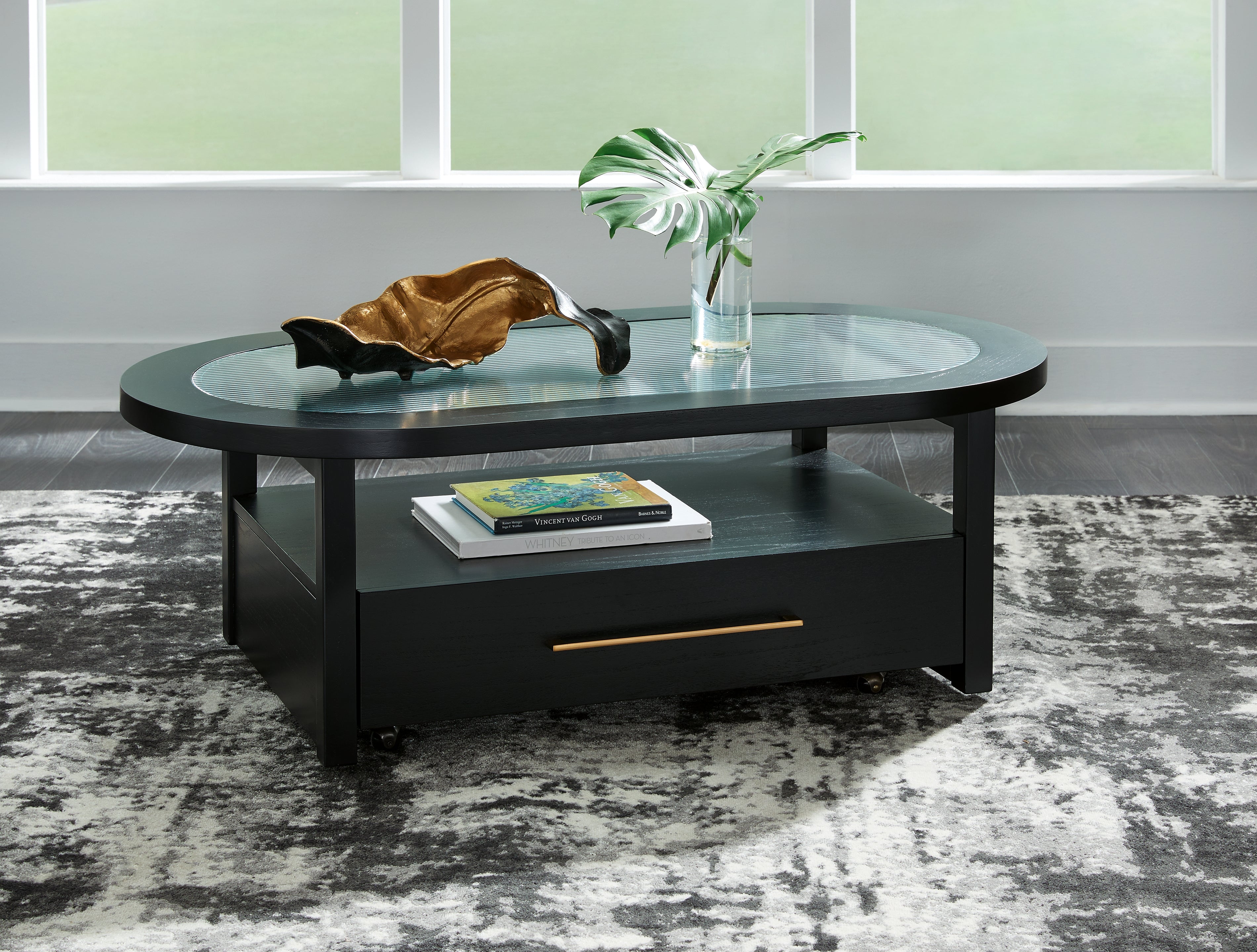A2Z Furniture - Ashley Furniture - Winbardi Coffee Table - Oval Cocktail Table / Black - T786-0