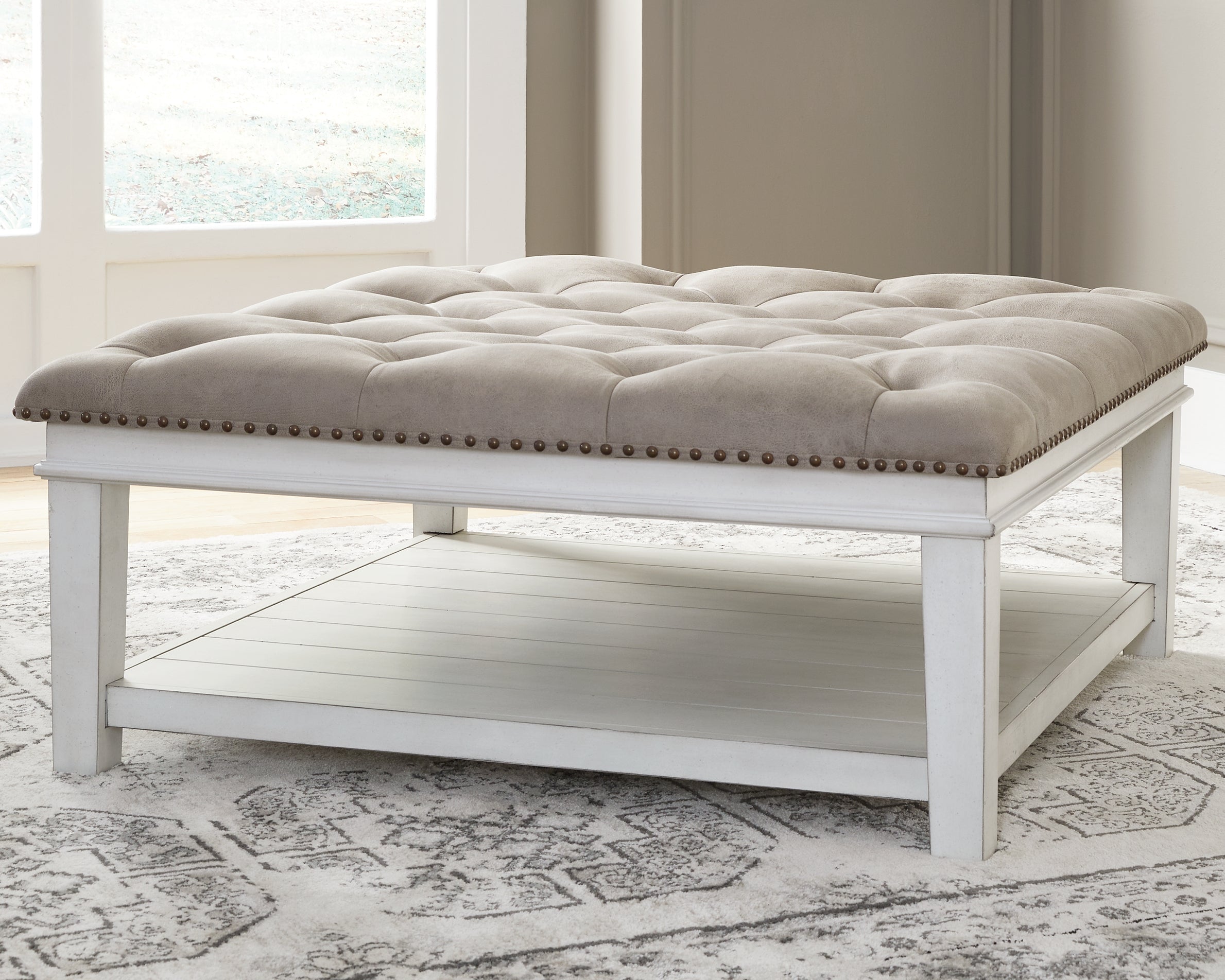 A2Z Furniture - Ashley Furniture - Kanwyn Upholstered Ottoman Coffee Table - UPH Ottoman Cocktail Table / Whitewash - T937-21